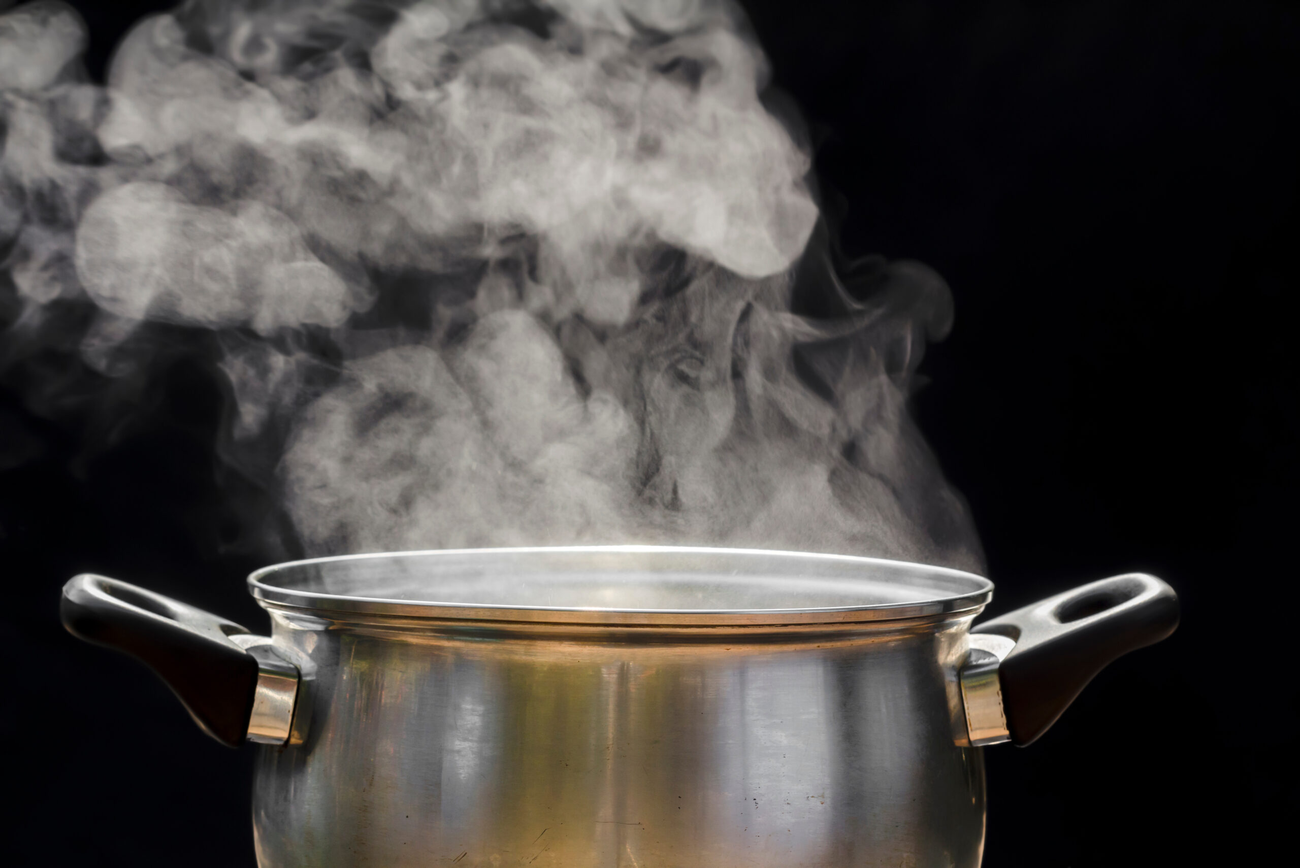 Image of a pot with steam coming out, indicating the pot and contents are hot.