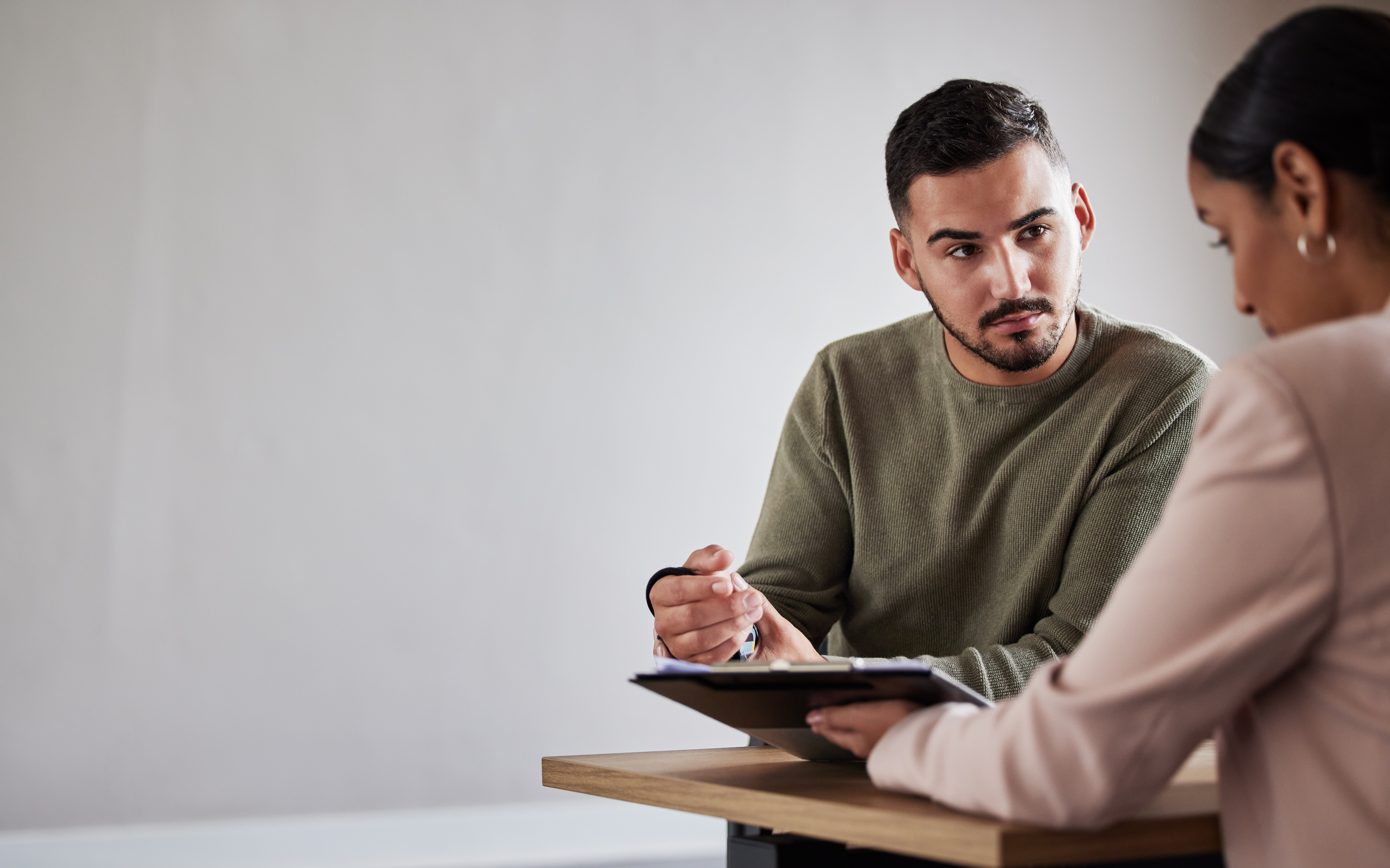 Injured worker talking to a legal professional about applying for workers